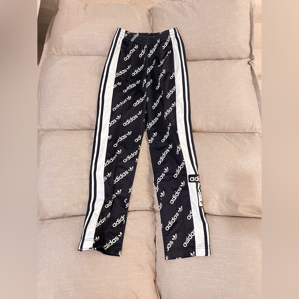Adidas track pants with side buttons